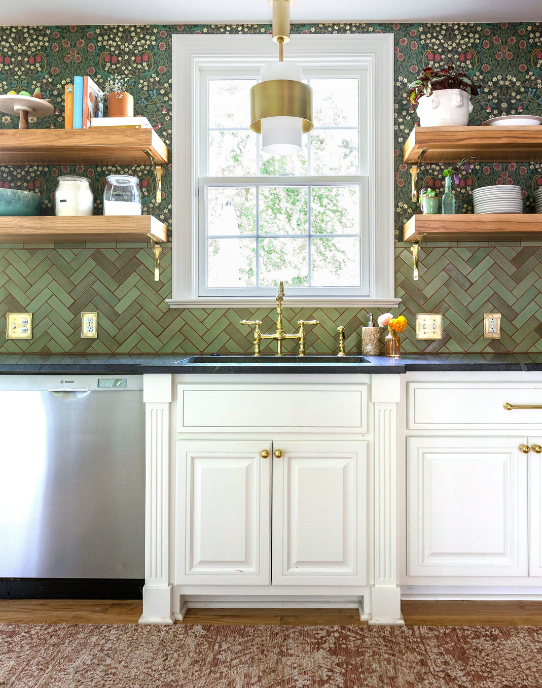 Patina Craftsman Herringbone kitchen backsplash tile behind the sink with floating shelves