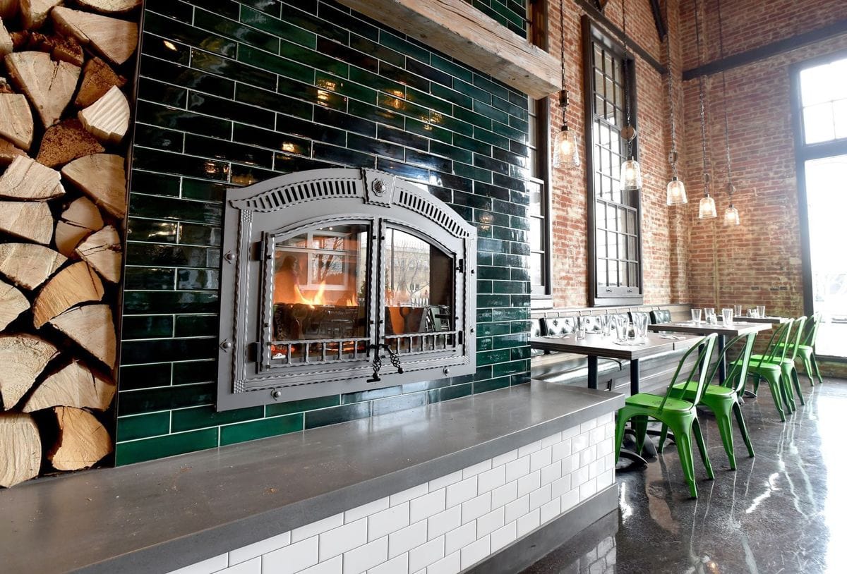emerald green subway tile, emerald green tile, emerald green subway tile fireplace, emerald green subway tile bar