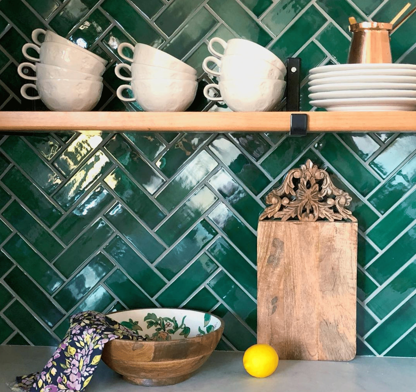 emerald green herringbone tile kitchen backsplash closeup